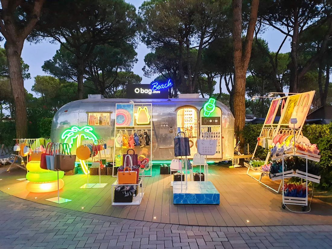 O bag Beach Store at Union Lido — Airstream retail stand at dusk